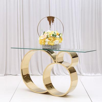 China Newest Arrival Five Star Hotel Luxury Gold Silver (Height) Adjustable Rose Gold Shiny Stainless Steel Frame Glass Top Wedding Console Table for sale