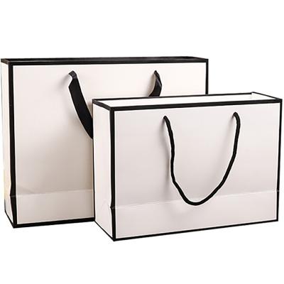 China Greaseproof Customizable Logo Printing Foldable White Kraft Paper Handbag Manufacturer For Packaging for sale