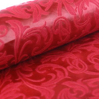 China Orchind anti-curvature red thick non-woven paper wrapping paper in wonderland introductory papers chrysanthemum texture flower birthday party gift for sale