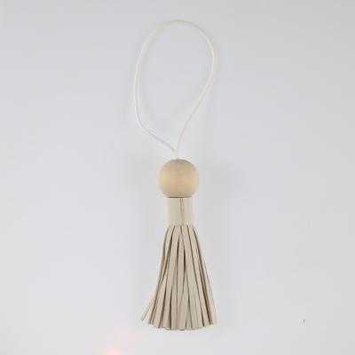 China Fashoion OEM ODM Leather Tassels Wholesale PU Leather Tassel Charm Gift Wood Accessories Tassels for sale