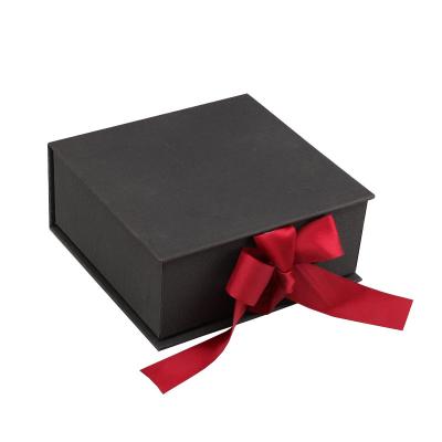 China Custom Recyclable Your Own Logo Luxury Black Cosmetic Box Creative Folding Flip Top Empty Paper Boxes Gift With Ribbon for sale