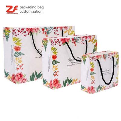 China Recyclable Custom Cute Paper Gift Cartoon Bag Thank You Shopping Bags With Ribbon Handle for sale