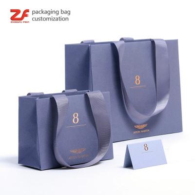 China Recyclable Customized Logo Printed Clothing Luxury Shopping Cosmetic Packaging Recycle Paper Bags for sale