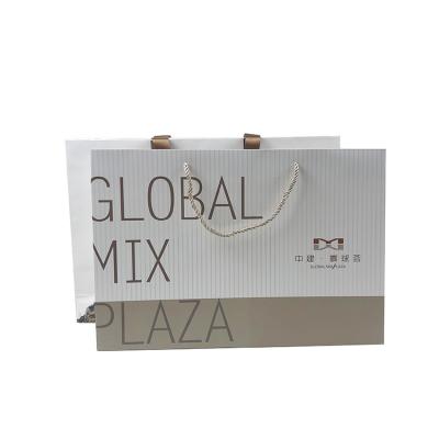 China Factory Recyclable Luxury Bag Custom Logo White Printing Shopping Slogan Wedding Favors Art Paper Bags for sale