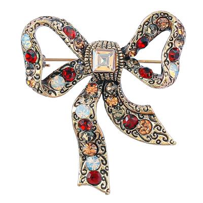 China Trendy New Fashion Jewelry Rhinestone Bow Brooch Pins For Women Clothing Accessories for sale