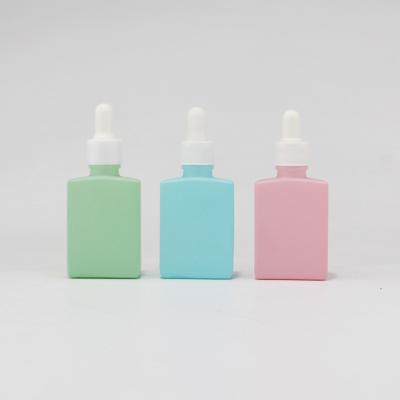 China New Design Cosmetic Square Color Glass Custom Bottle With Plastic Blank Dropper For Essential Oil for sale