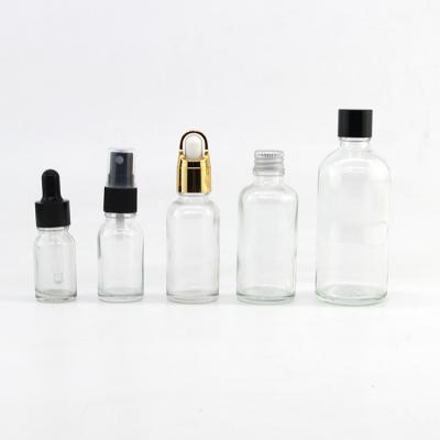 China Custom Cosmetic Premium Quality Cosmetic Packaging Round Shape Essential Oil Dropper Personal Care Glass Material Clear Glass Bottle for sale