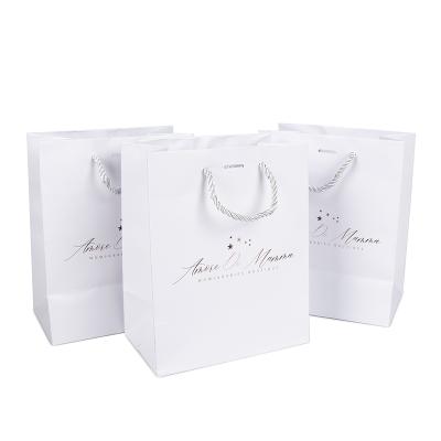 China Custom Luxury Retail Clothing Paper Bag Gift Wrapping Shopping Packaging Paper Bags With Handles for sale