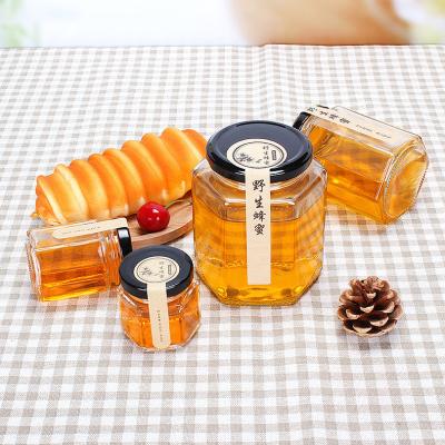 China Household Products Wholesale Price Full Different Sizes Foam Packing Honey Jars Hexagonal Glass for sale