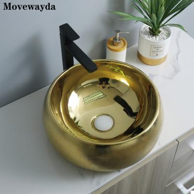 China Easy Clean Luxury Sanitary Gold Color Ceramic Countertop Bathroom Ware Process Drawing Style Single Wash Basin for sale