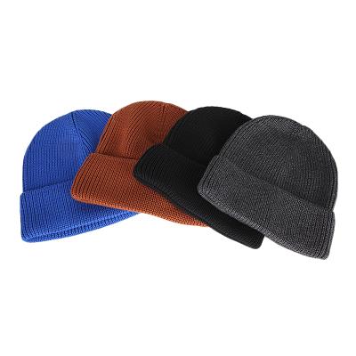 China COMMON Low Price Plain Knitted Hats Custom Logo Women Mens Knit Beanies Winter for sale