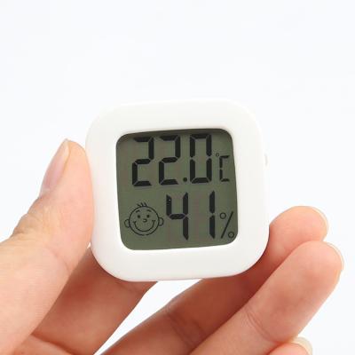 China Temperature Hygrometer Monitor Room Temperature Measurement Monitor Meter With Baby Smiling Design Mini Thermometer Hygrometer Indoor Thermometer for sale