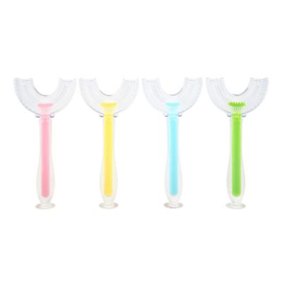 China Children's Home Tooth Food Grade Silicone Brush Cleaning U Shaped Toothbrush 360 Transparent Head Four Colors For Children for sale