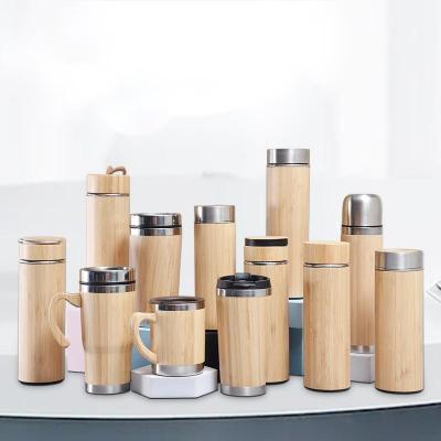 China Viable Keep Cold Hot Inner Bamboo Fiber Water Bottle Stainless Steel 500ml Vacuum Flask Bamboo Water Bottle With Handle Bamboo Lid for sale