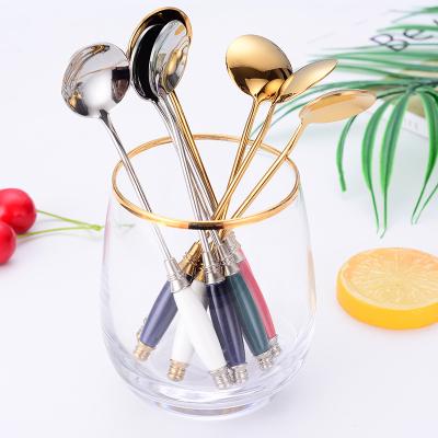 China Creative popular stocked ceramic handle design 18/8 stainless steel gold teaspoon cutlery set for household for sale