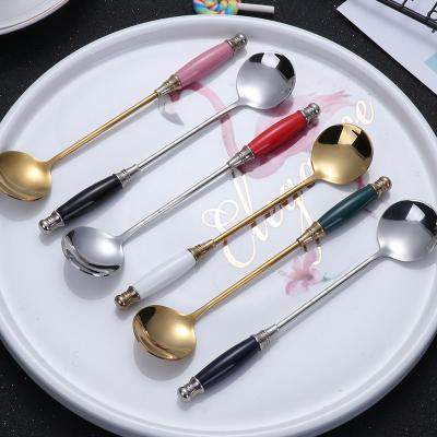 China Creative popular stocked ceramic handle design 18/8 stainless steel gold teaspoon cutlery set for household for sale