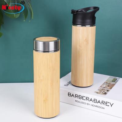 China Viable Bamboo Vacuum Insulated Bottle With Stainless Steel Thermo Bottle With Tea Infuser Strainer Double Wall Tumbler Water Bottle for sale