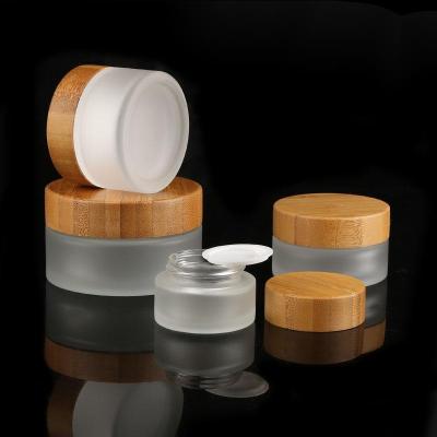 China Hot Sale Durable 15g 30g 50g 100g Bamboo Cosmetic Cream Jar Frosted Glass Jar With Bamboo Wooden Cap for sale