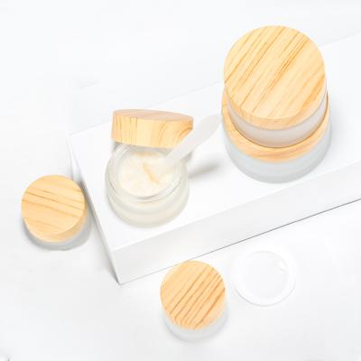 China Durable New Products 5g, 15g, 30g, 50g Skin Care Cream Jar Wood Grain Body Cream Eco-friendly Glass Container for sale