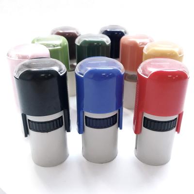 China Custom Inkback Handle Pressing 18MM Tilting Plastic Cylindrical Round Shell Material Set Of Children Stamps for sale