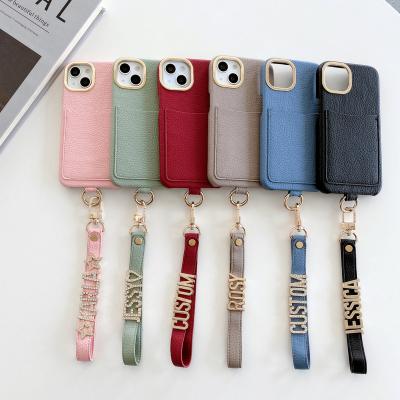 China Custom Shockproof Feminine Pebble Leather DIY Name Card Holder Phone Case For iPhone 14 Pro Max Protective Lanyard Bracelet Phone Cover for sale