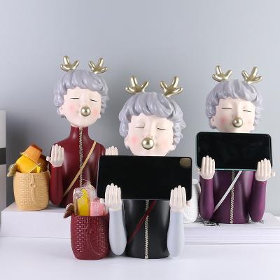 China Simple Modern China Resin Crafts Antlers Bubble Girl Mobile Phone Holder Home Living Room Storage Creative Decorations for sale