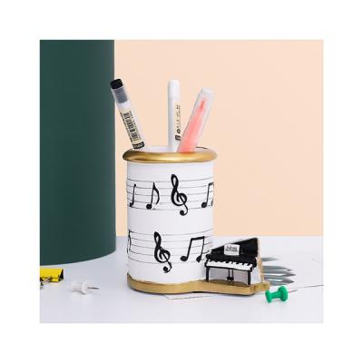 China Nordic Europe Lightweight Luxury Resin Open Piano Musical Note Line Pen Holder Makeup Brush Holder For Creative Student Gift Decoration for sale