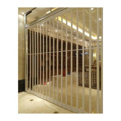 China Stylish Transparent Polycarbonate Side Folding Door Modern Shop Sliding Security Plastic Folding Door for sale