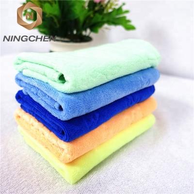 China Brand New Compressed Towel Special Ultrathin Fiber Towel Knurling 70*140 Thick Red Cartoon Embossed Large Adult Beach Bath Towel Wholesale for sale