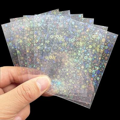 China Super Strong Seal That Can Barely Tear Off Stars Holographic Flash Film Soft Protector For Photocard Trading Card Sports Game Idol Card Laser Clear Card Sleeves for sale