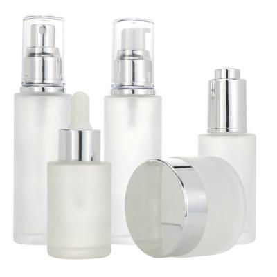 China Luxury high end high quality glass empty cosmetic bottle and jar set emulsion skin care packaging sets glass bottle for lotion and serum for sale