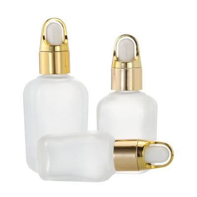 China Luxury High Qiality Square Dropper Glass Bottles 15ml 30ml 50ml 100ml With Shiny Gold Silver Collar For Serum Essential Oil for sale