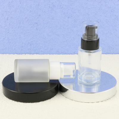 China New designed cosmetic bottle glass cosmetic round flat shape essential oil pump glass bottle for sale