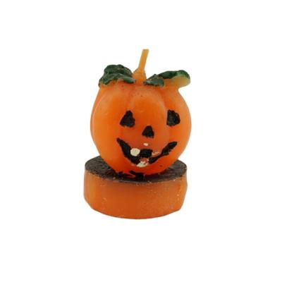 China Flameless Fancy Hand Carved Custom Paraffin Wax Pumpkin Happy Halloween Tealight Candles for sale