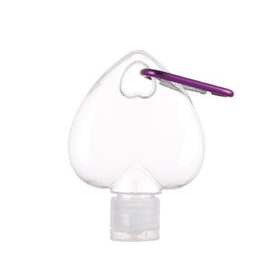 China Hot Sale 50ml PETG Heart Shape Hand Sanitizer Hook Cosmetic Bottle With Flip Top Hand Gel Bottle PETG Key Chain Bottle Stock for sale