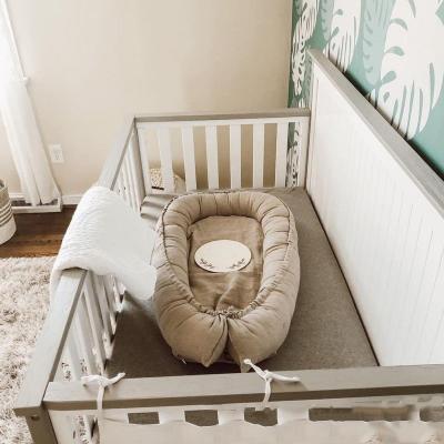 China Pea Travel Crib Cocoon Safety Babynest Customized Flame Retardant Newborn Organic Sleeper Baby Pod Nest for sale