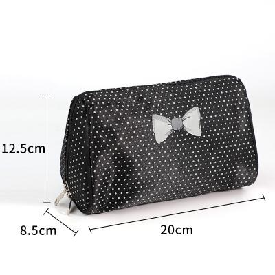 China Factory Direct Travel Durable Makeup Storage Female Portable Single Point And Bow Printed Cosmetic Bag for sale