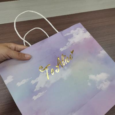 China Recyclable custom printed luxury logo white paper shopping carry on gift packaging bag with ribbon handles for store for sale