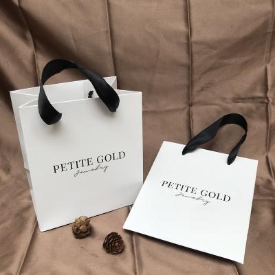 China Recyclable Customized Logo Design Paper Luxury Gift Bag Packaging Bag Customized Shopping Paper Bag With Ribbon Handle for sale