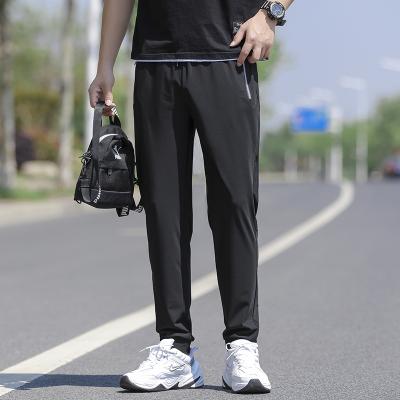 China Anti-wrinkle summer thin ice silk casual pants for men stretch ice silk air conditioning pants for men sports quick-dry thin pants for men for sale