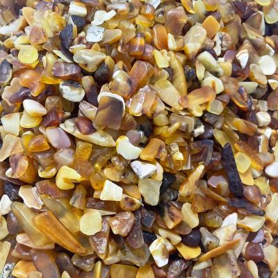 China Europe Natural Rock Beeswax Rough Stones Raw Amber Beeswax Gravel Tumble Stones for sale