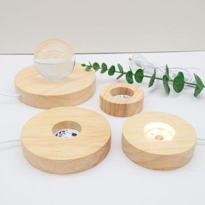 China Europe Wholesale USB Circle Shaped Crystal Tower Holder Base Healing Crystal Sphere Led Wooden Stand for sale