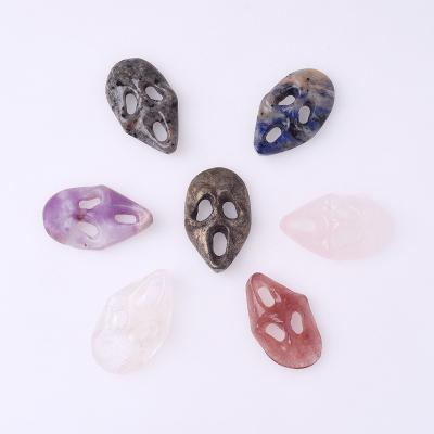 China Europe Natural Rainbow Fluorite Carved Ghost Mask Hand Carved Healing Stones Obsidian Crystal Skulls Masks for Halloween Decoration for sale