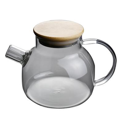 China High quality creative sustainable hand blown borosilicate home 1000ML transparent glass teapot with bamboo lid for sale