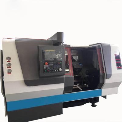 Cina CNC inclinato del tornio del letto di asse TCK6350 4 che gira la macchina concentrare del tornio di CNC del letto di inclinazione della macchina TCK6350 in vendita