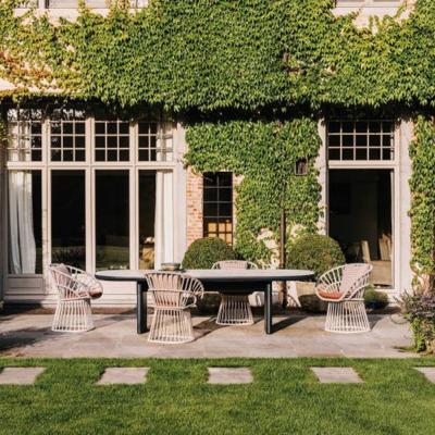 China Modern Hotel Garden Dining Table and Chair Villia Backyard Dining Set Outdoor Stone Black Aluminum Artificial Patio Rope Table for sale