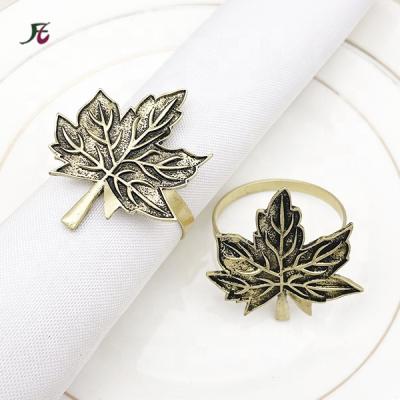 China Amazon Leaf Metal Napkin Ring Napkin Holder Gold Eco-friendly Napkin Loops For Wedding Table Decoration Wholesale for sale