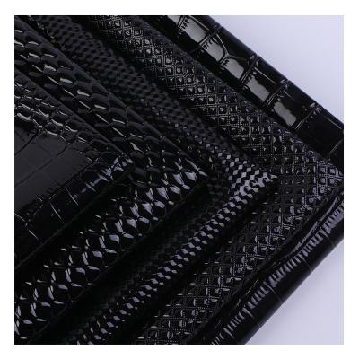 China 0.9mm Thickness Crocodile Stone Waterproof Black High Gloss Pattern PVC Leatherette For Sofa Bag Leather Material for sale