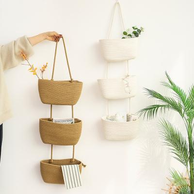 China Sustainable Three Layer Woven Cotton Rope Baby Storage Basket Wall Mounted Decorative Storage Basket Wall Mounted Flower Basket for sale