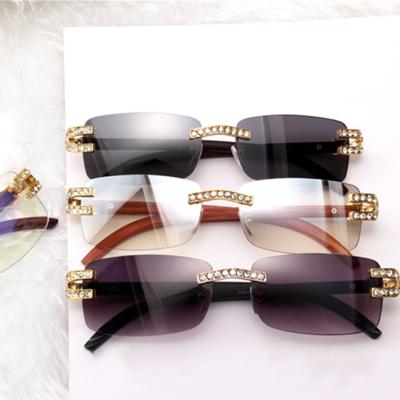 China Fashion Sunglasses Shape Trendy Women Clear Rimless Small Square Rhinestone Diamond Frames Shades Rectangle Sunglasses for sale